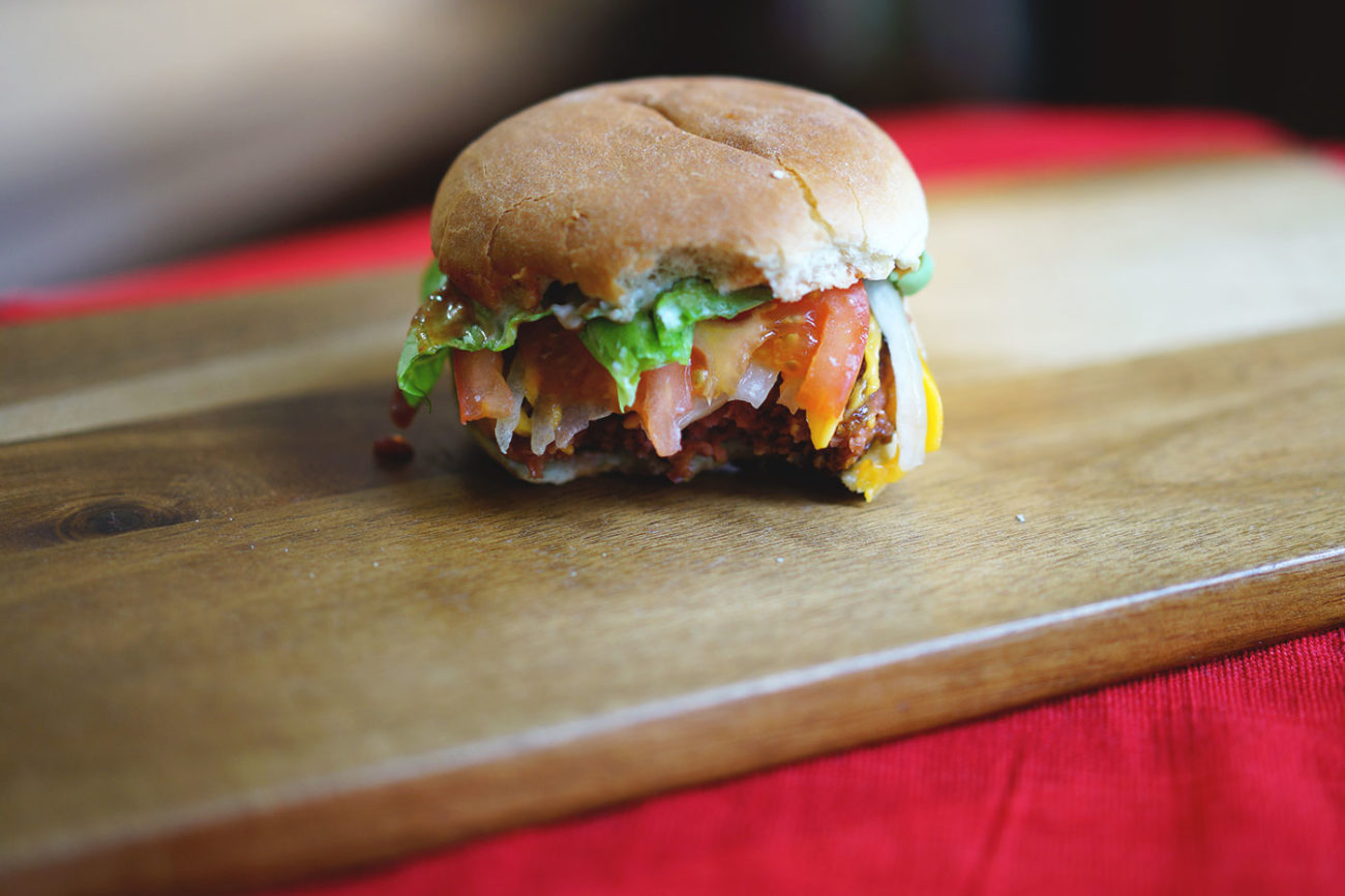 beyond-burger-cheeseburger-made-with-onions-tomatoes-lettuce