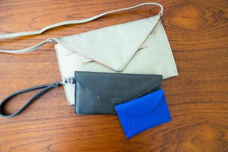 Canope Verde vegan bags have a smart textured finish with one in gold another in graphite and a card case in bright blue