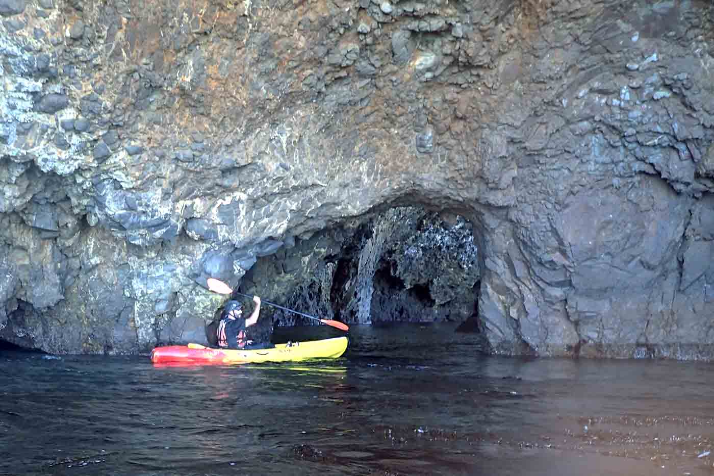 kayaking the many sea caves at Santa Cruz Island in California