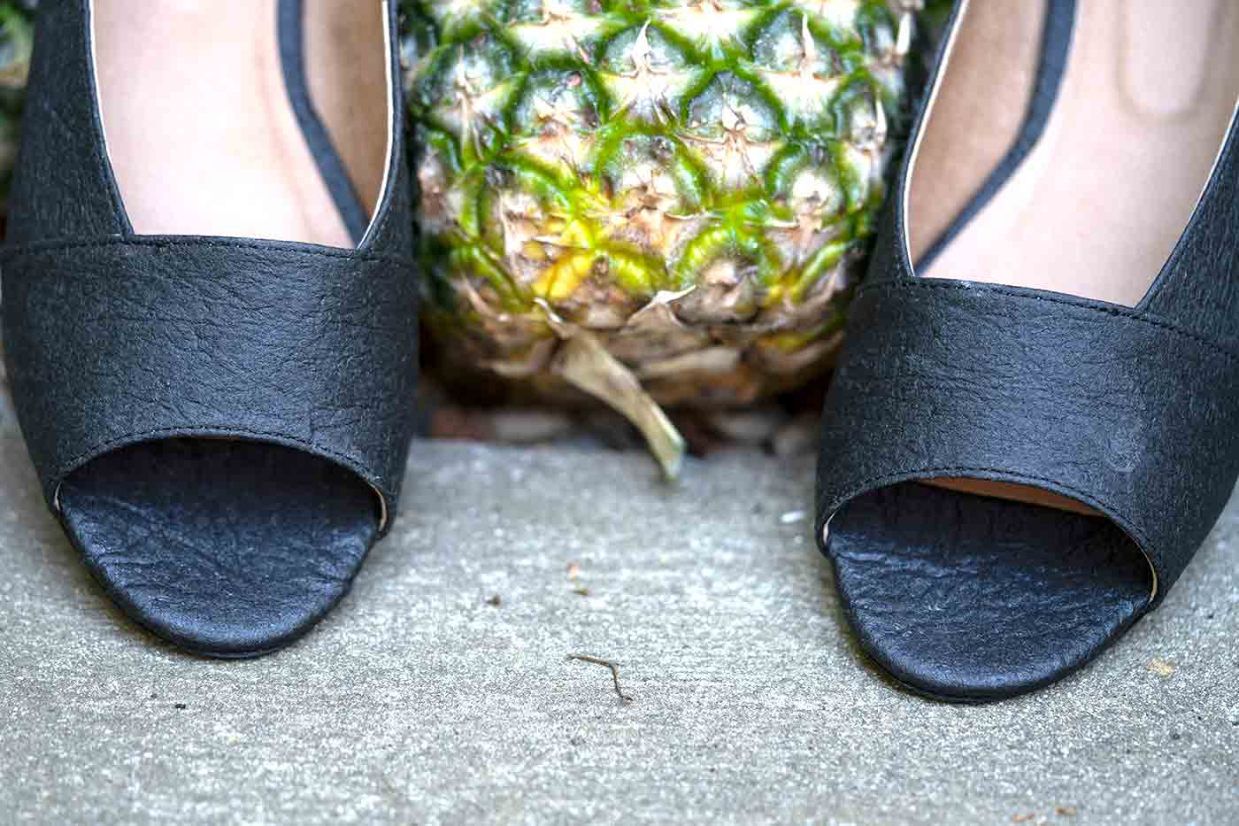 Pinatex shoes from Nae online shown with a pineapple used to make the vegan leather