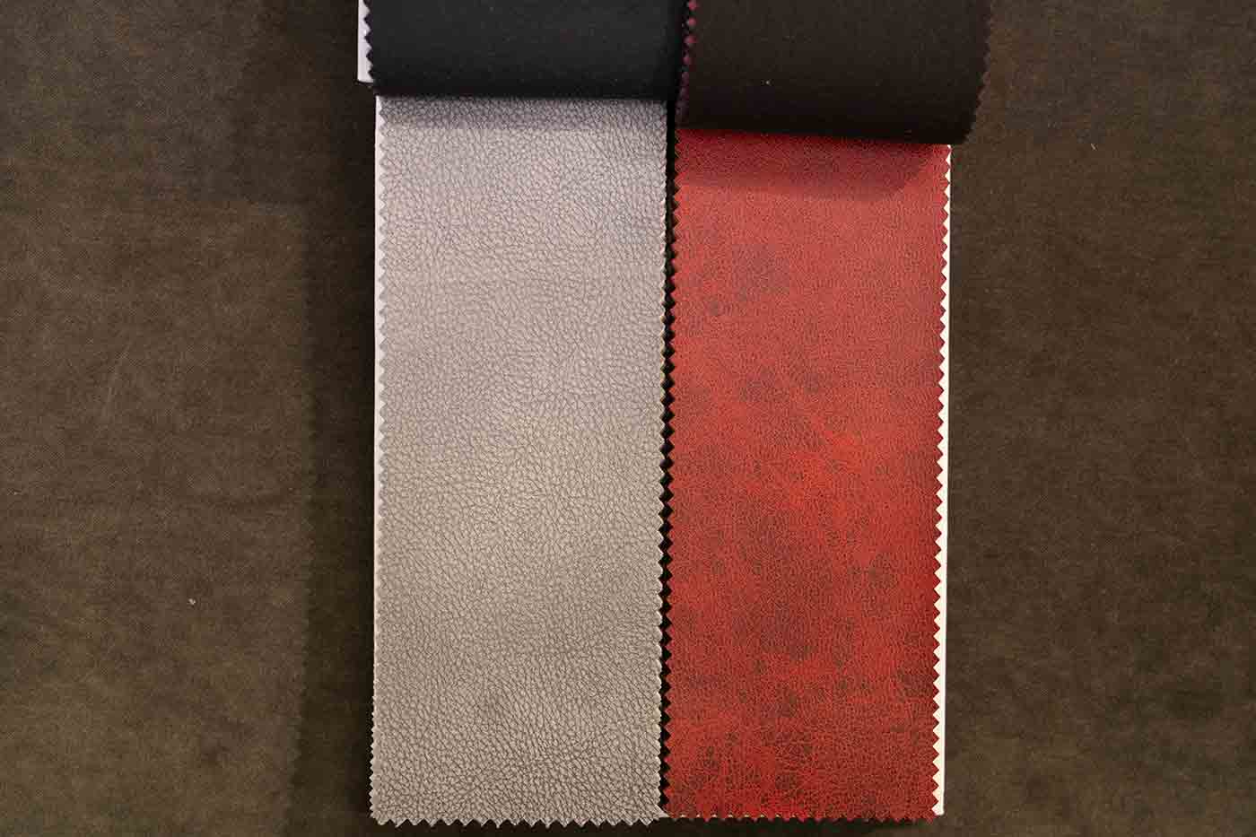 faux leather swatches in red and grey at Calico Corners in Pasadena sold as upholstery fabric