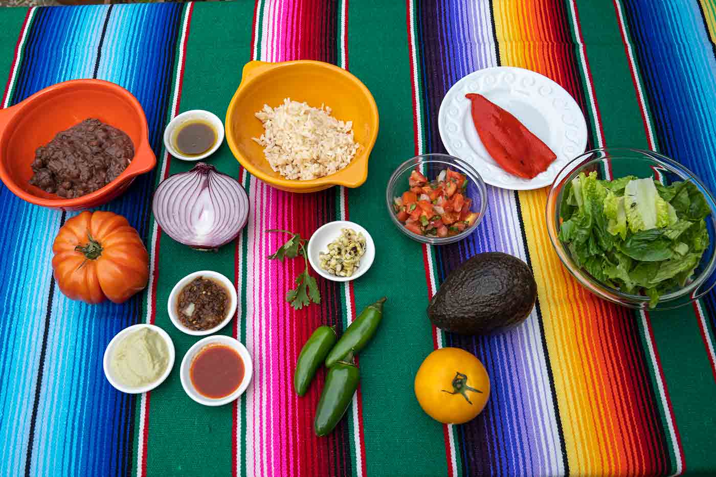 vegan salad ingredients for Tacodeli salad on a Mexican blanket