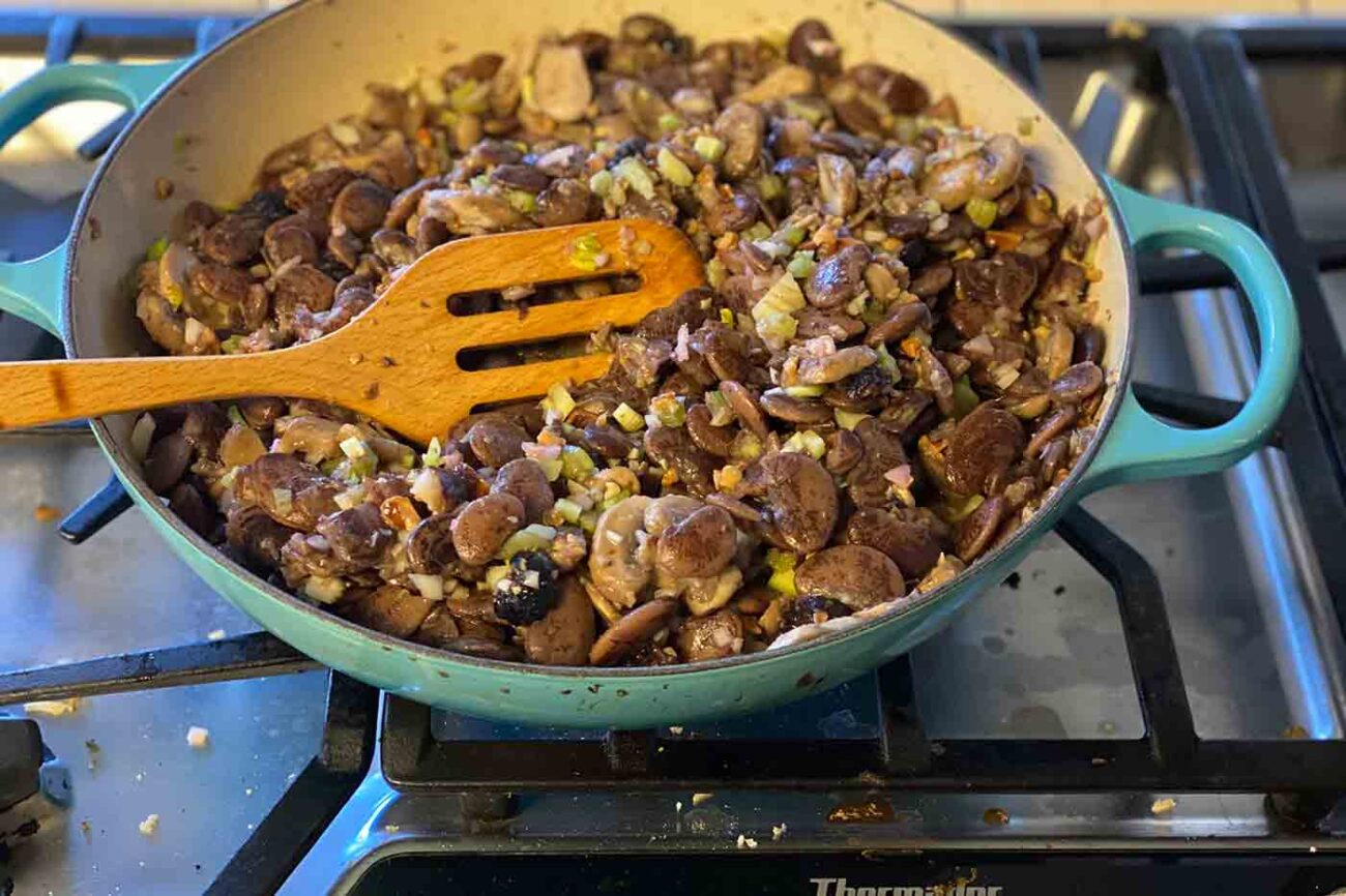 vegan Christmas lima bean salad on the stove in a Le Creuset pan