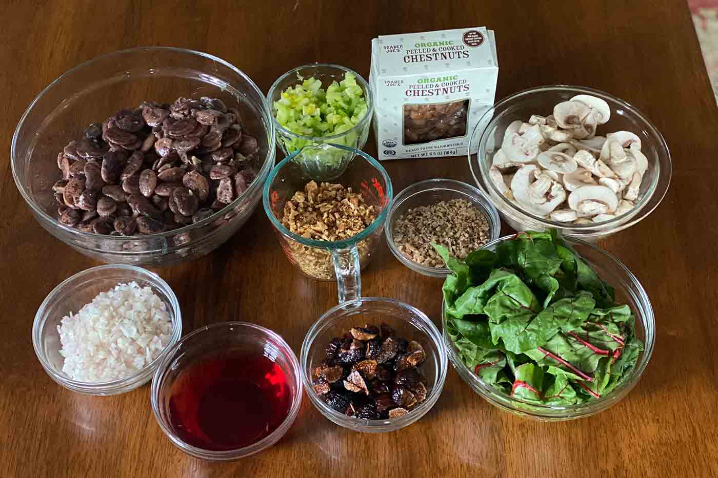 ingredients for vegan Christmas lima bean salad with beans and wine vinegar and shallots and chopped celery and more