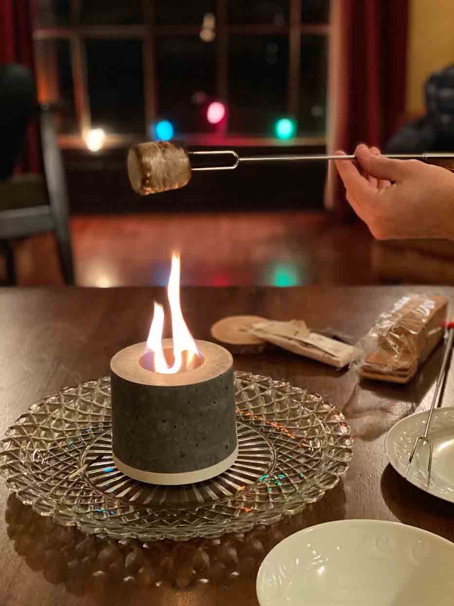 marshmallow roasting on a tabletop fire